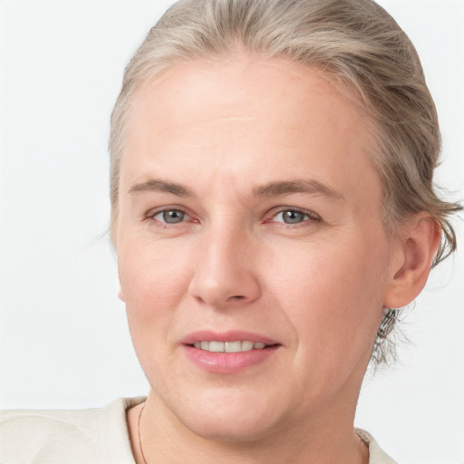 Joyful white adult female with short  brown hair and grey eyes