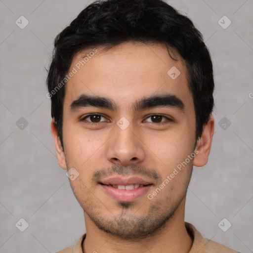 Joyful latino young-adult male with short  black hair and brown eyes