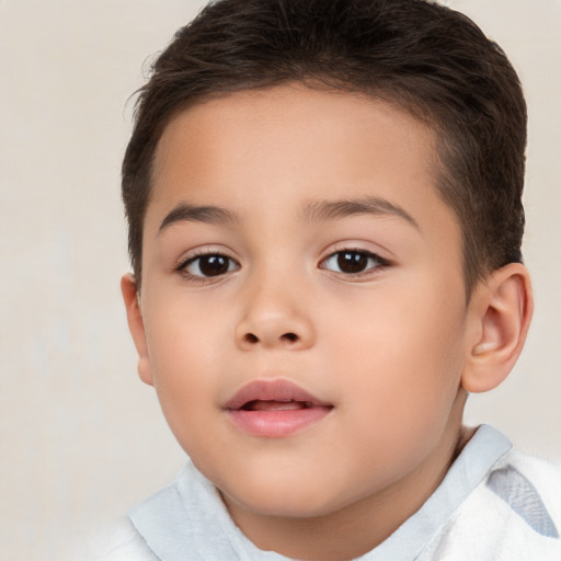 Joyful white child female with short  brown hair and brown eyes