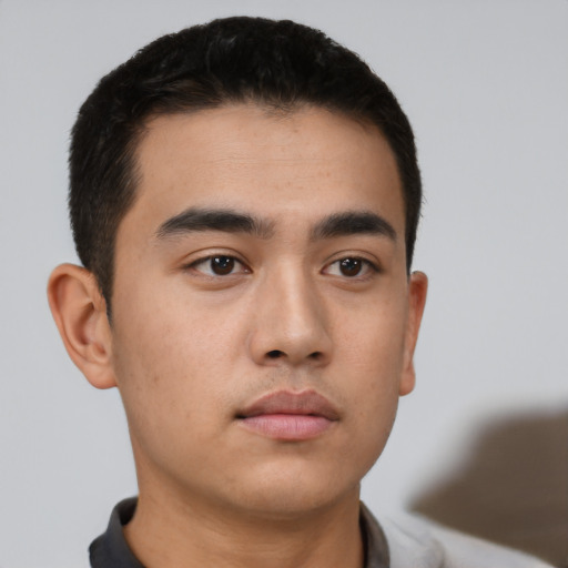 Neutral white young-adult male with short  black hair and brown eyes