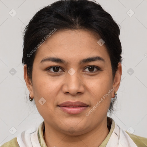 Joyful latino young-adult female with medium  brown hair and brown eyes