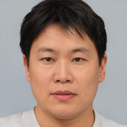 Neutral asian young-adult male with short  brown hair and brown eyes