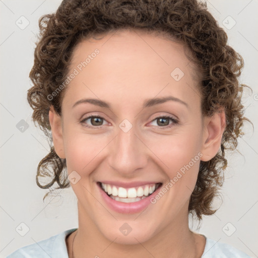 Joyful white young-adult female with medium  brown hair and green eyes