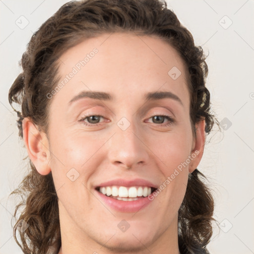 Joyful white young-adult female with medium  brown hair and green eyes