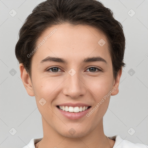 Joyful white young-adult female with short  brown hair and brown eyes