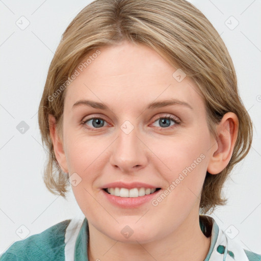 Joyful white young-adult female with medium  brown hair and blue eyes