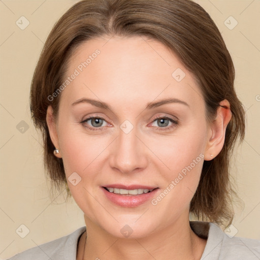 Joyful white adult female with medium  brown hair and grey eyes