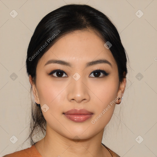 Joyful asian young-adult female with medium  black hair and brown eyes