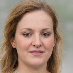 Joyful white young-adult female with medium  brown hair and blue eyes