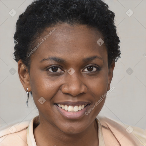 Joyful black young-adult female with short  brown hair and brown eyes