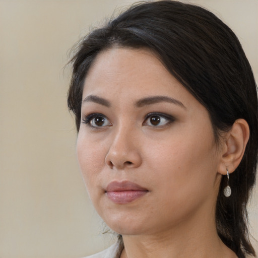 Neutral asian young-adult female with medium  brown hair and brown eyes