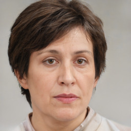 Joyful white adult female with short  brown hair and brown eyes