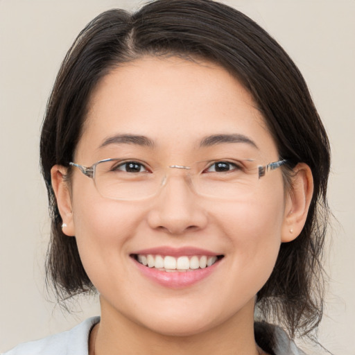 Joyful white young-adult female with medium  brown hair and brown eyes