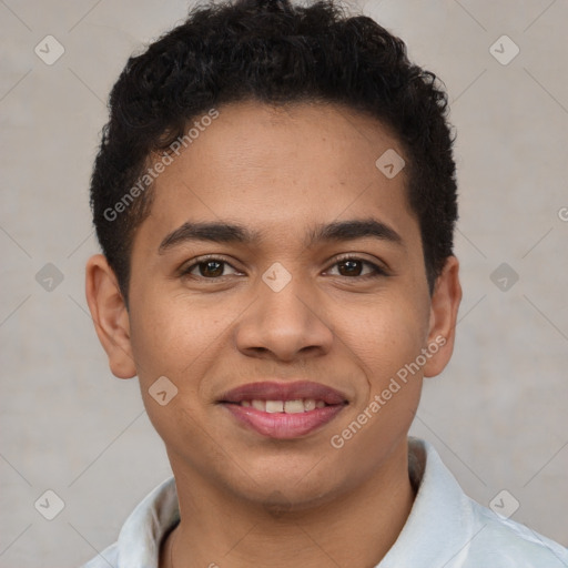 Joyful latino young-adult male with short  brown hair and brown eyes