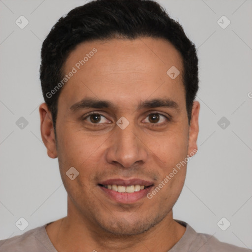Joyful latino young-adult male with short  black hair and brown eyes