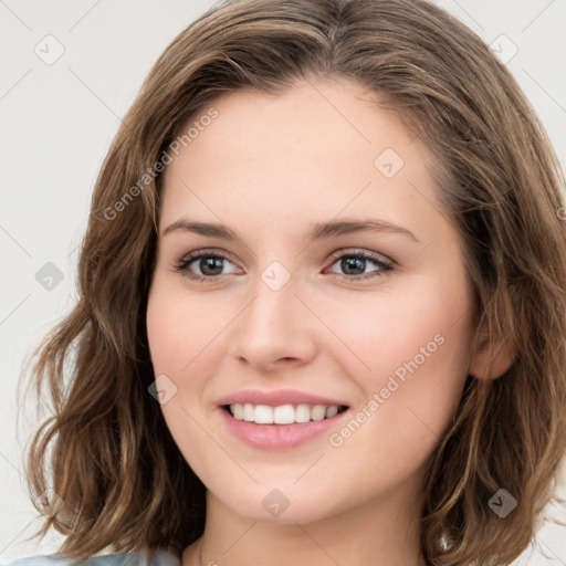 Joyful white young-adult female with medium  brown hair and green eyes