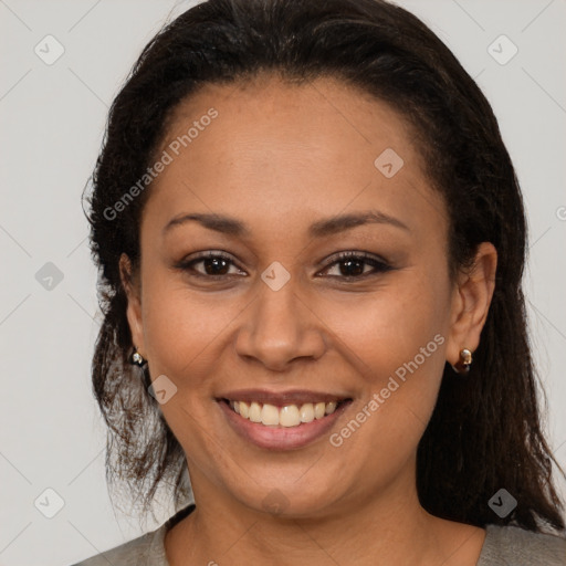 Joyful latino young-adult female with medium  brown hair and brown eyes