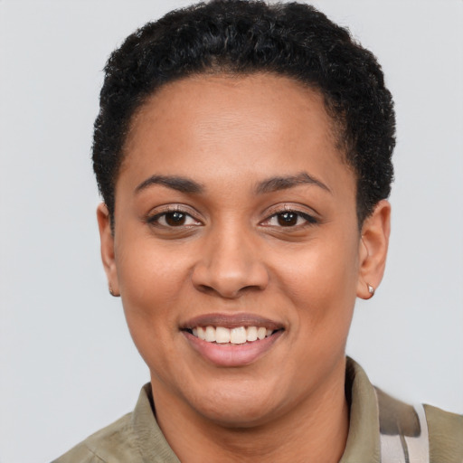 Joyful latino young-adult female with short  black hair and brown eyes