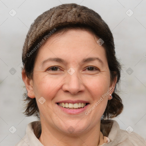 Joyful white adult female with short  brown hair and brown eyes