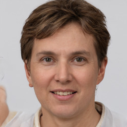 Joyful white adult female with short  brown hair and grey eyes