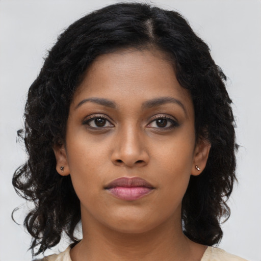 Neutral black young-adult female with long  brown hair and brown eyes