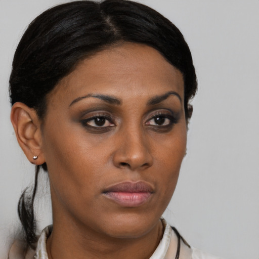Neutral latino young-adult female with medium  brown hair and brown eyes