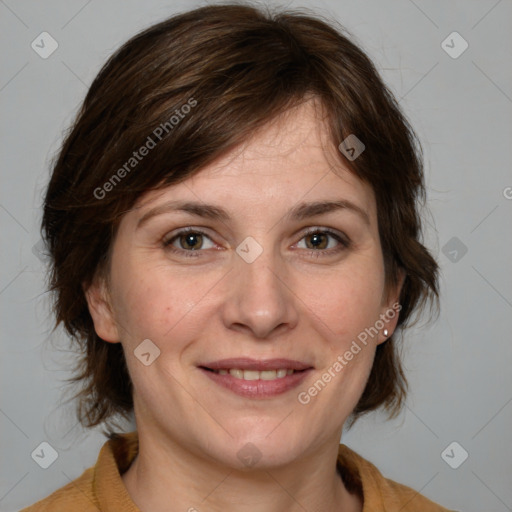 Joyful white adult female with medium  brown hair and grey eyes