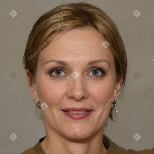 Joyful white adult female with medium  brown hair and grey eyes