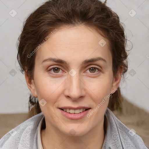 Joyful white adult female with short  brown hair and brown eyes