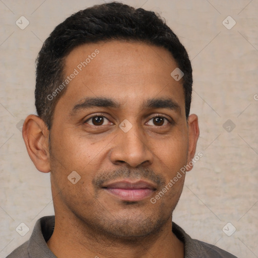 Joyful latino young-adult male with short  black hair and brown eyes