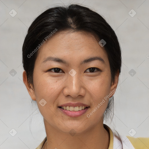 Joyful asian young-adult female with short  brown hair and brown eyes