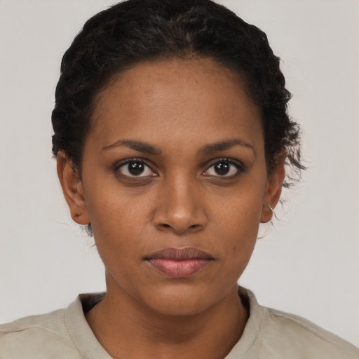 Neutral black young-adult female with short  brown hair and brown eyes