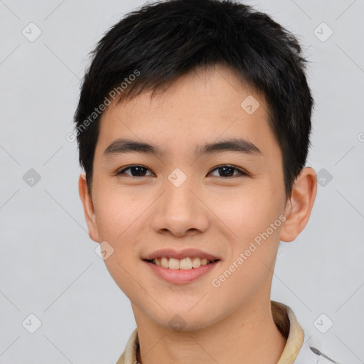 Joyful asian young-adult male with short  black hair and brown eyes