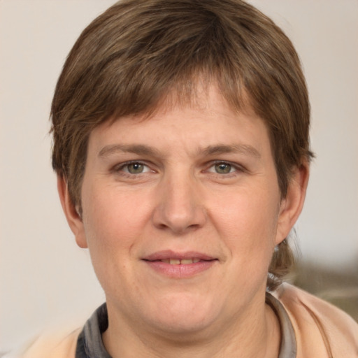 Joyful white adult female with short  brown hair and grey eyes