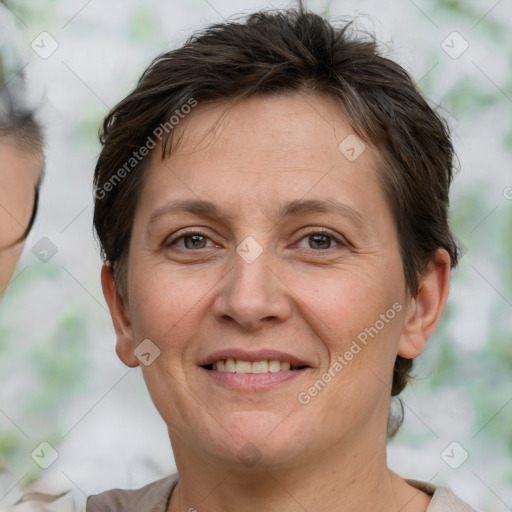 Joyful white adult female with short  brown hair and brown eyes