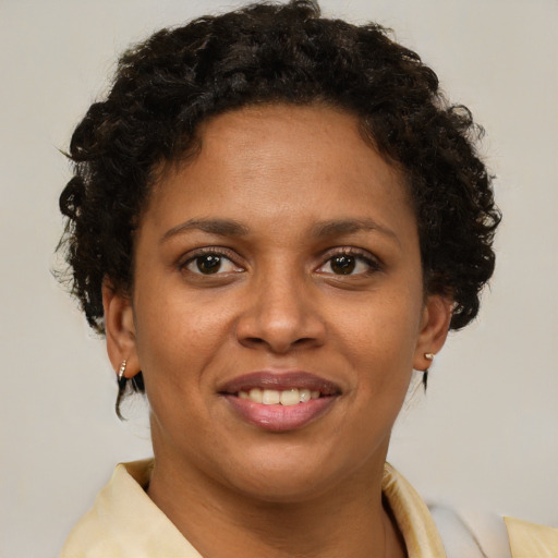 Joyful latino young-adult female with short  brown hair and brown eyes