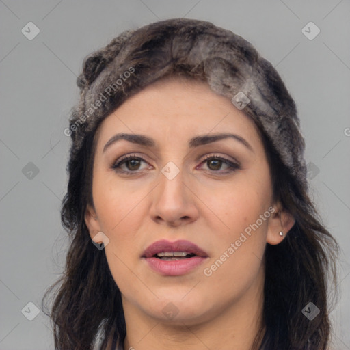 Joyful latino young-adult female with long  brown hair and brown eyes