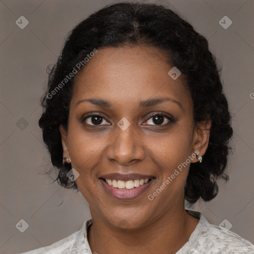 Joyful black adult female with medium  brown hair and brown eyes