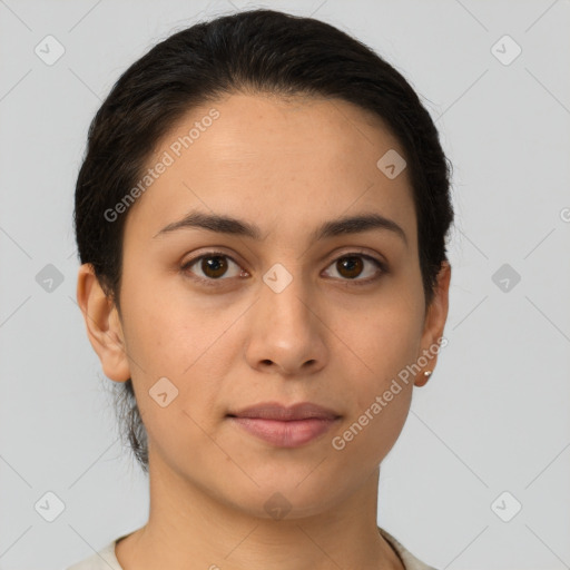 Joyful latino young-adult female with short  brown hair and brown eyes