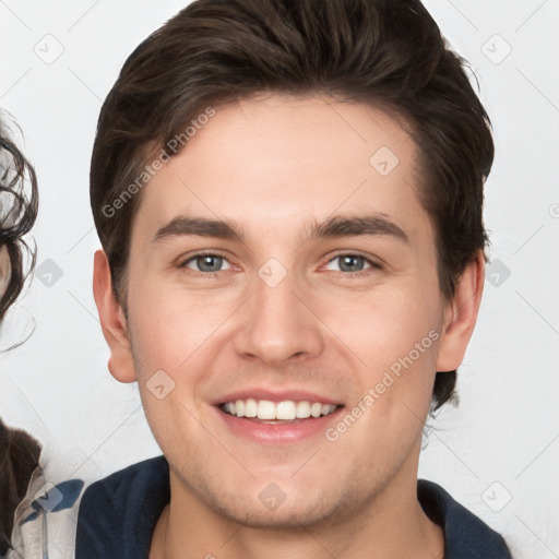 Joyful white young-adult male with medium  brown hair and brown eyes