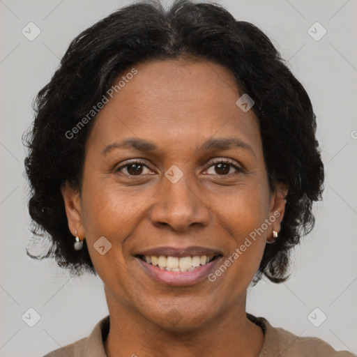 Joyful black adult female with short  brown hair and brown eyes