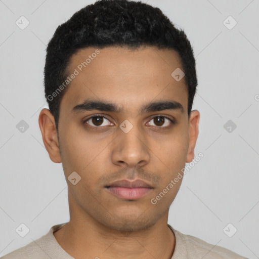 Neutral latino young-adult male with short  black hair and brown eyes