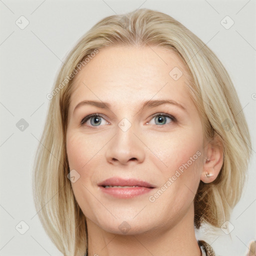 Joyful white young-adult female with medium  brown hair and blue eyes