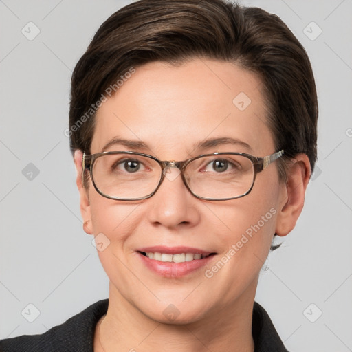 Joyful white adult female with short  brown hair and grey eyes