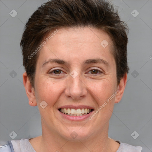 Joyful white adult female with short  brown hair and grey eyes