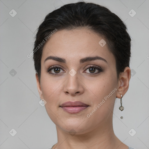 Joyful white young-adult female with short  brown hair and brown eyes