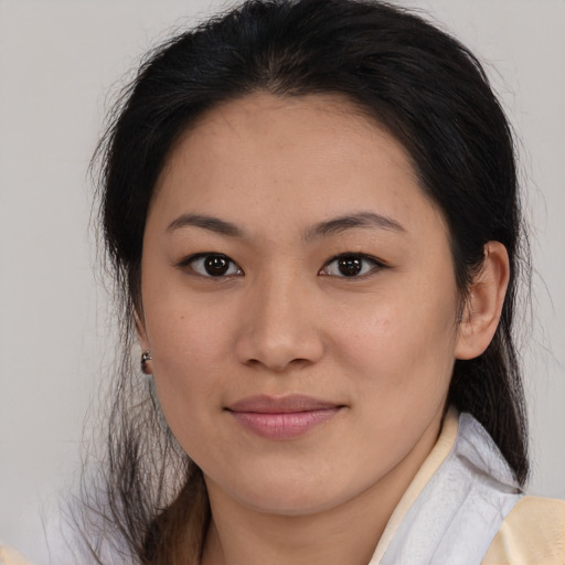 Joyful asian young-adult female with medium  brown hair and brown eyes