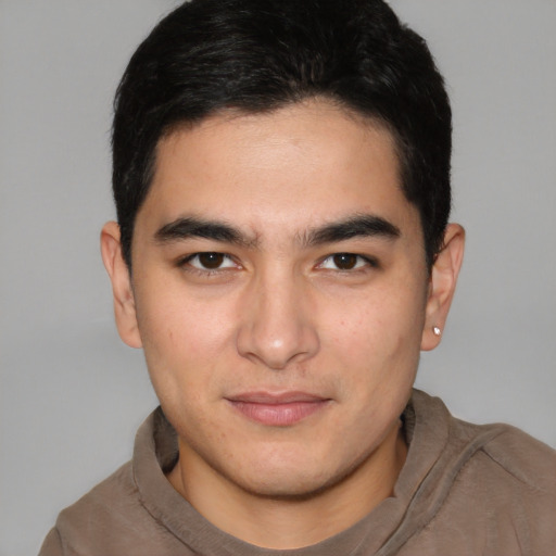 Joyful latino young-adult male with short  brown hair and brown eyes