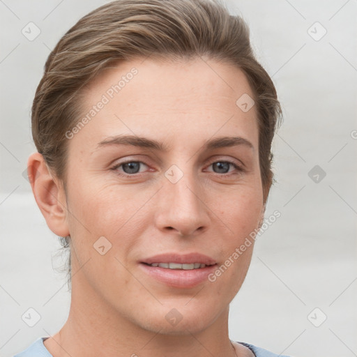 Joyful white young-adult female with short  brown hair and grey eyes