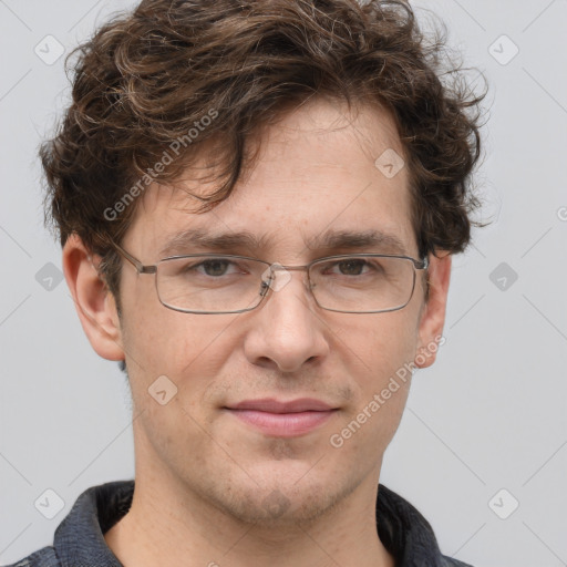 Joyful white adult male with short  brown hair and grey eyes